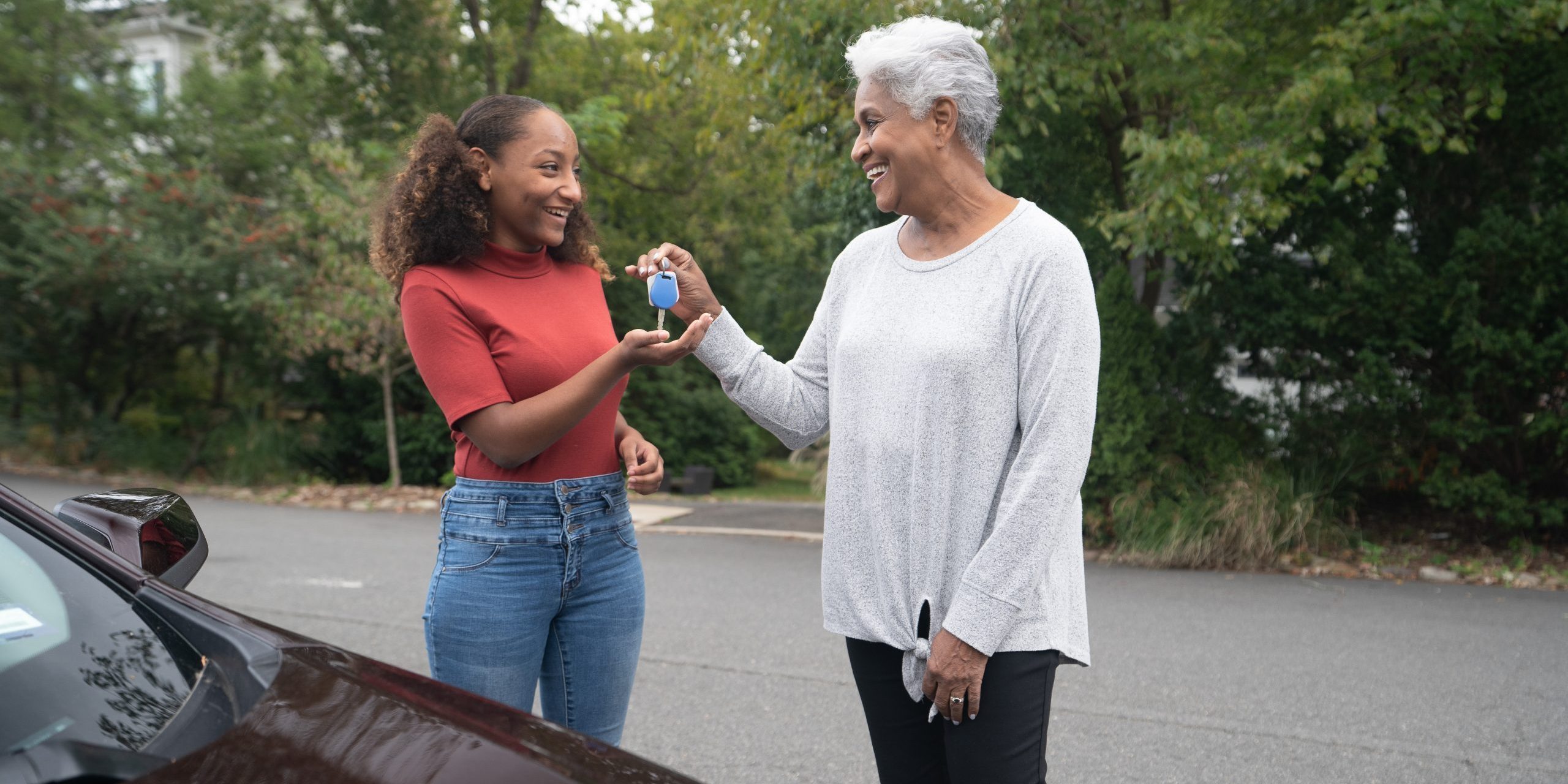 A grandparent handing keys to a teen. Source: NHTSA Image Library.